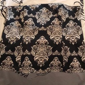 Black; tan and white strapless top